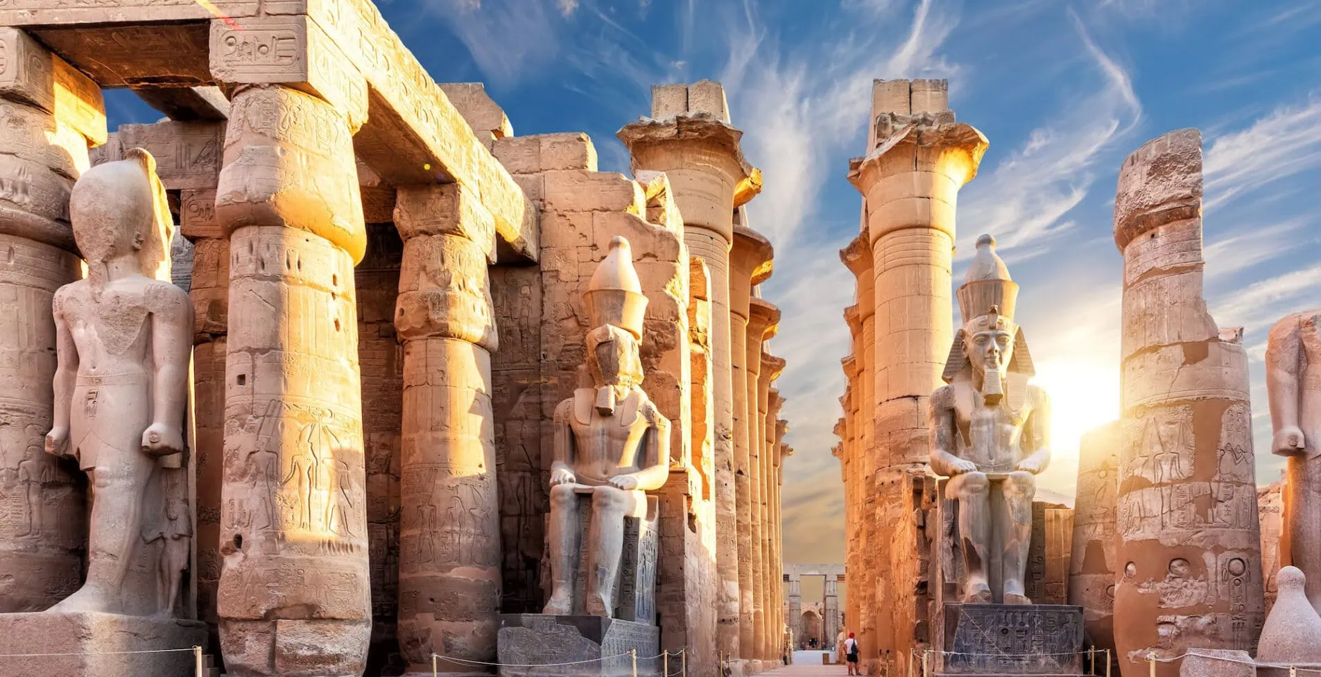 Columns and statues of the Luxor temple main entrance first pylon Egypt
