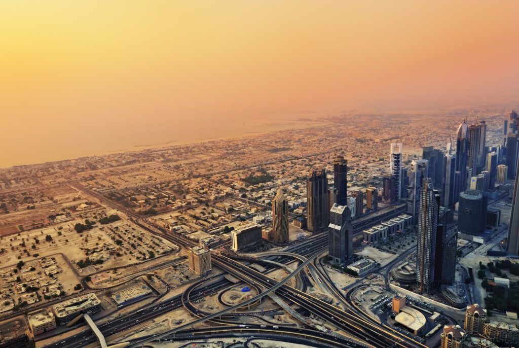 Sheikh Zayed Road in Dubai at sunset – skyline with towering skyscrapers including the Rose Rayhaan, the world’s tallest hotel.