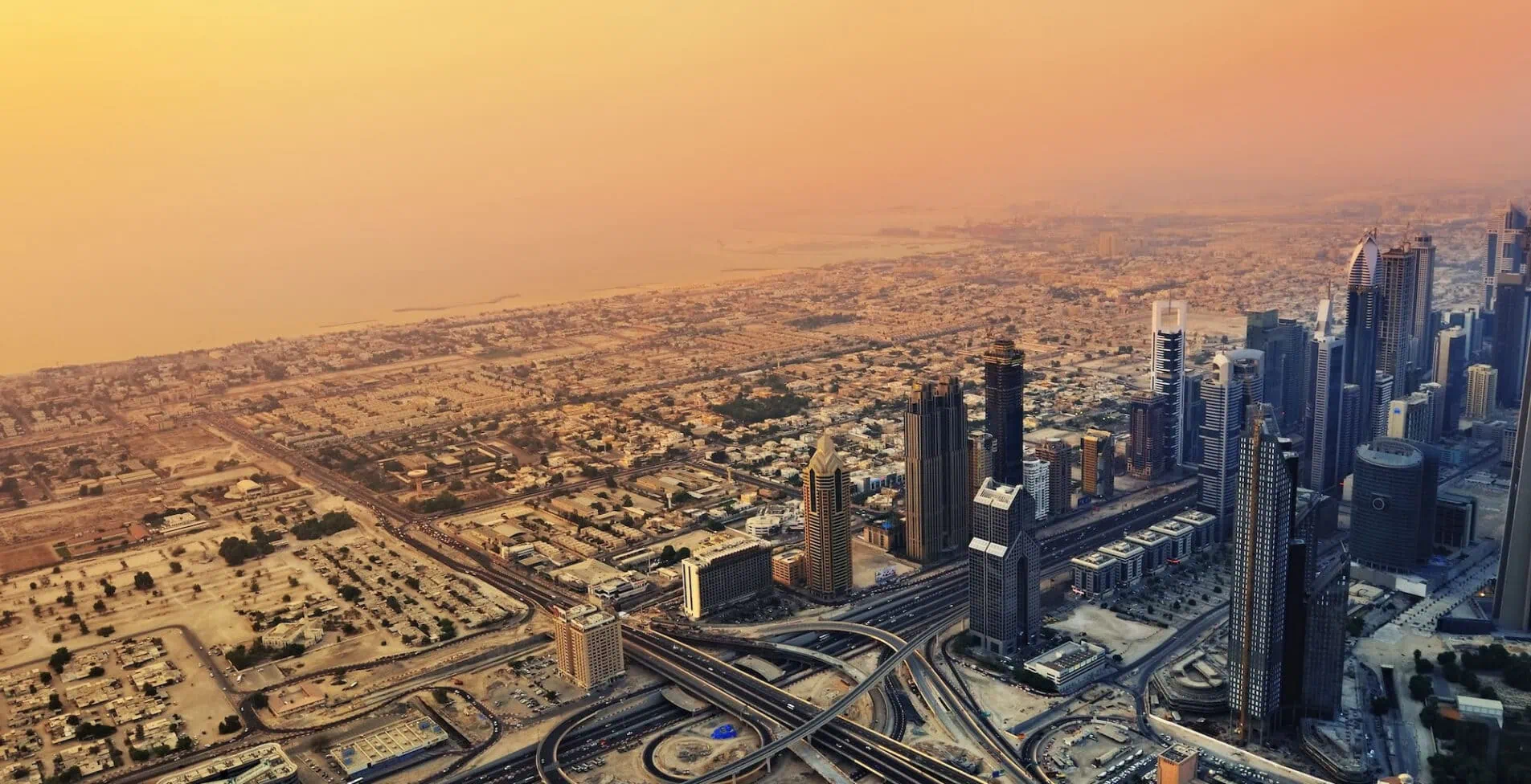 DUBAI SEP 01 Dubai skyline along Sheikh Zayed Road at sunset on Sep 1 2010 Dubai UAE. It is home to most of Dubai s skyscrapers including the most tall hotel in the world Rose Rayhaan