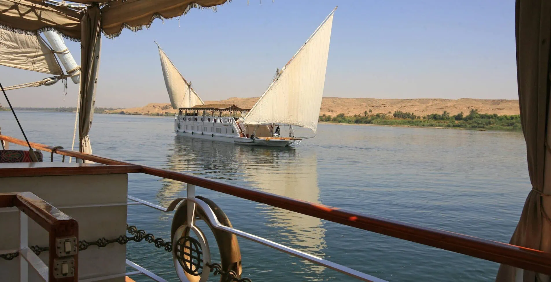 Dahabiya passengers sailing ship on the Nile river Egypt 1905x976 crop 47 37