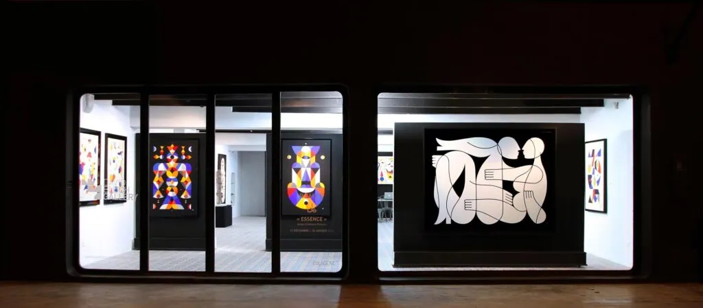 David Bloch Gallery with glass-front exhibition space displaying colorful geometric artworks and a large black-and-white figure composition Marrakech