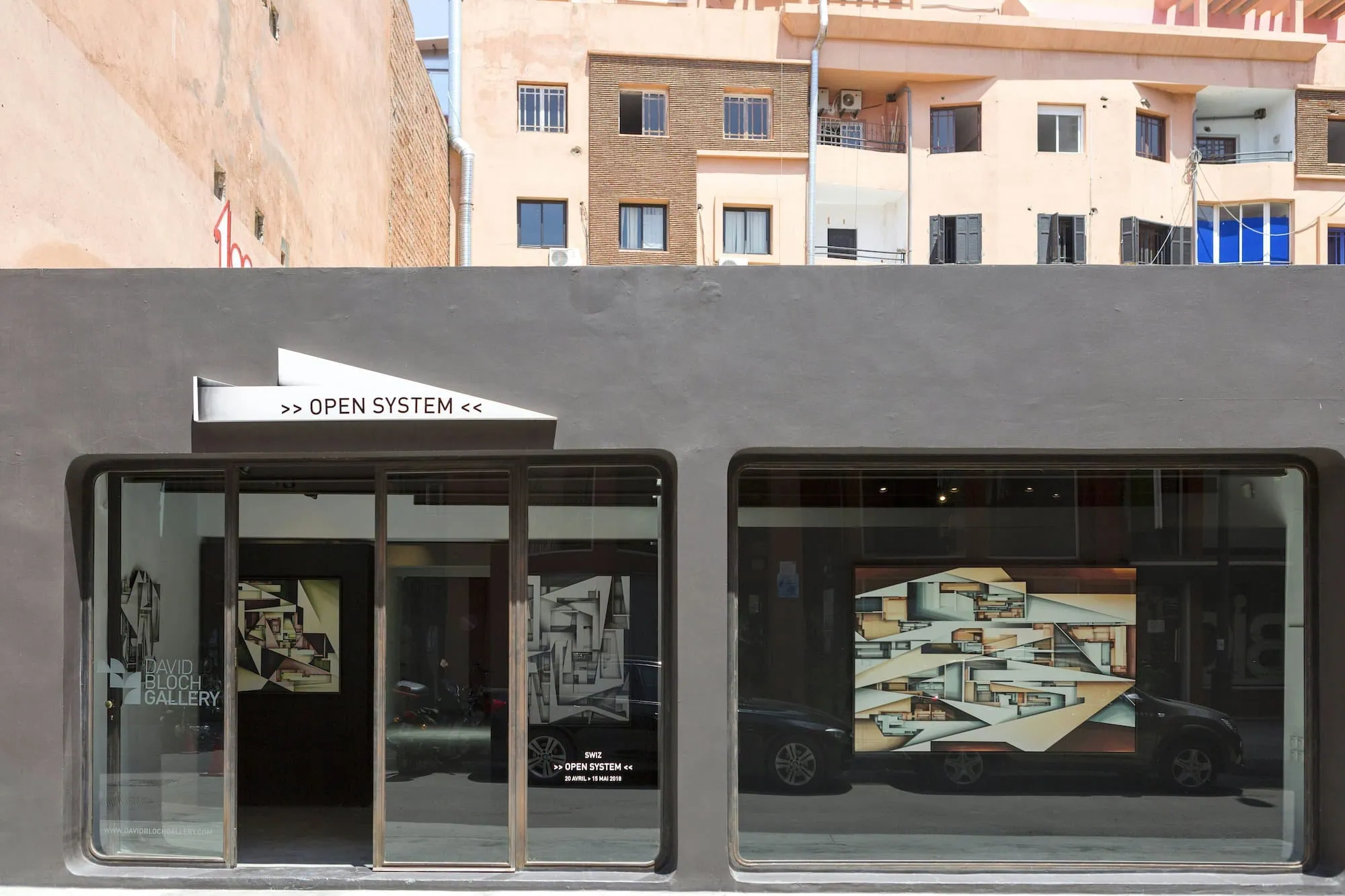Modern David Bloch Gallery exterior with large windows displaying contemporary art