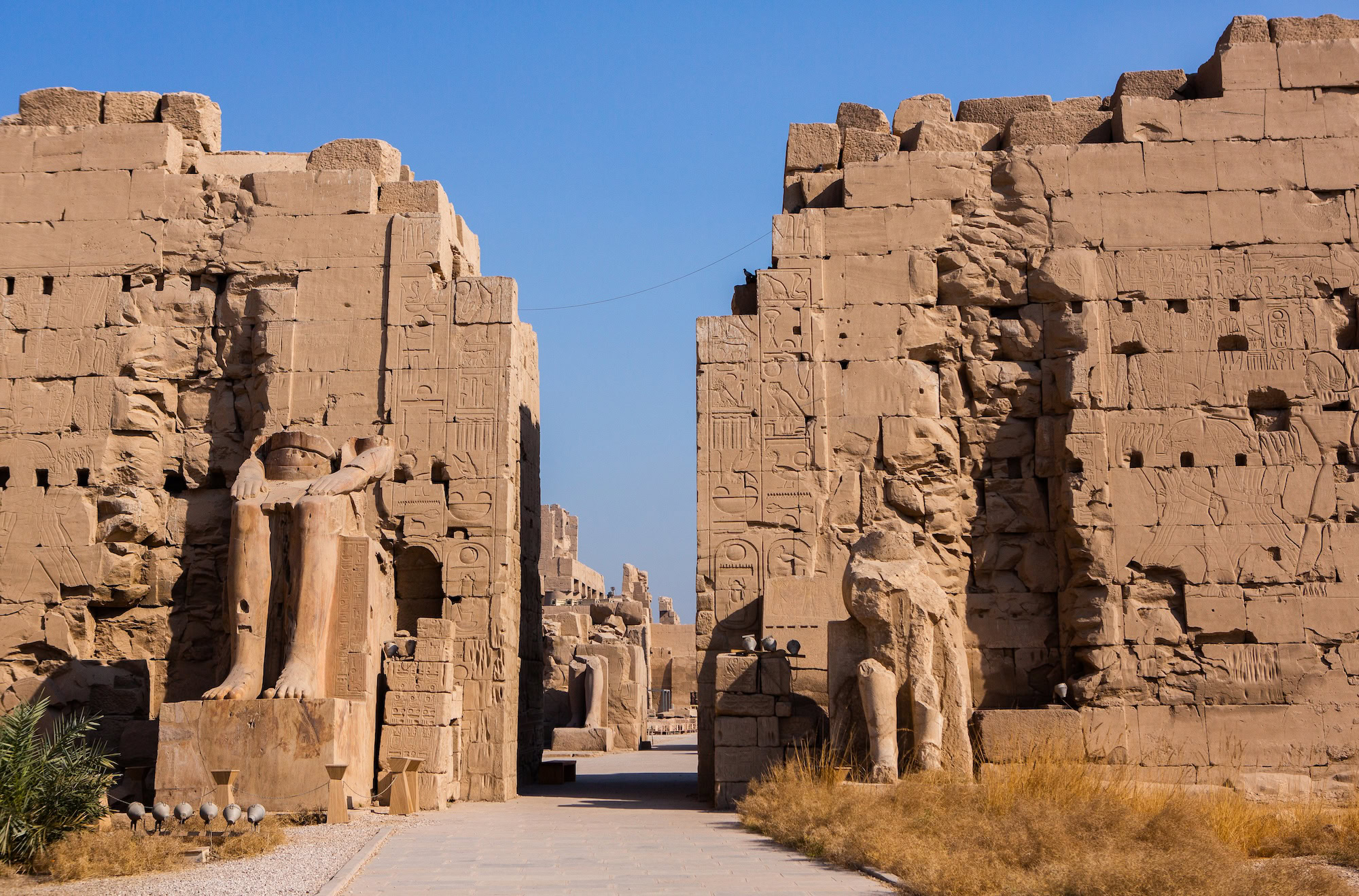 Ancient stone columns with hieroglyphics at Karnak Temple Complex in Luxor, Egypt