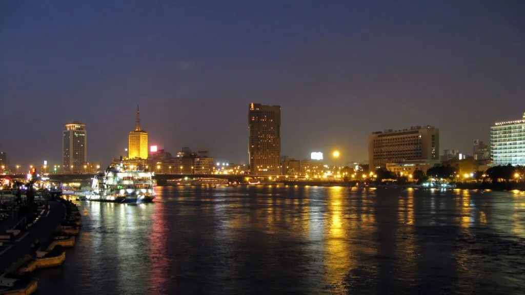 Cairo skyline reflected on the Nile at night