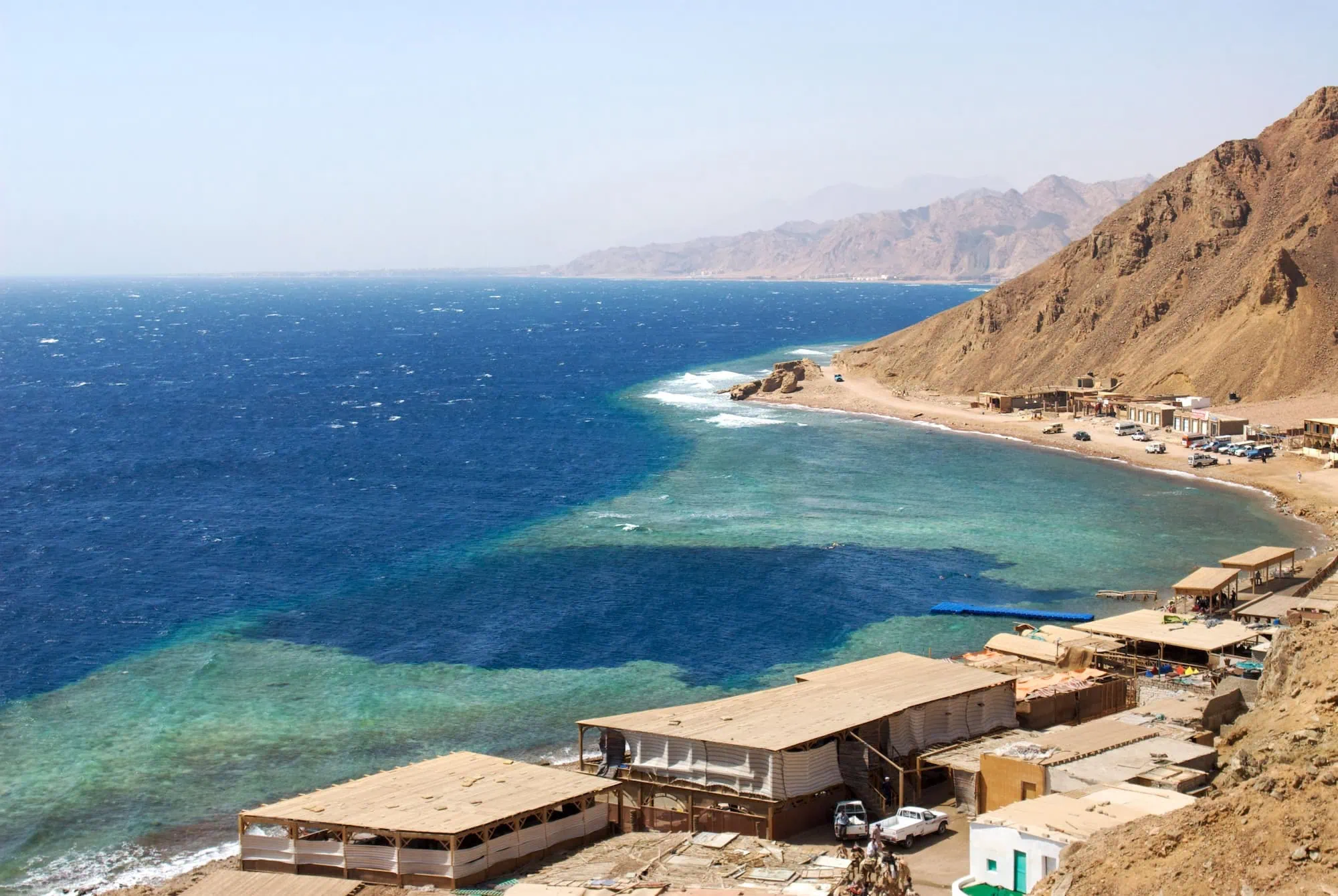 Red Sea coastline with diving platforms and coral reef area