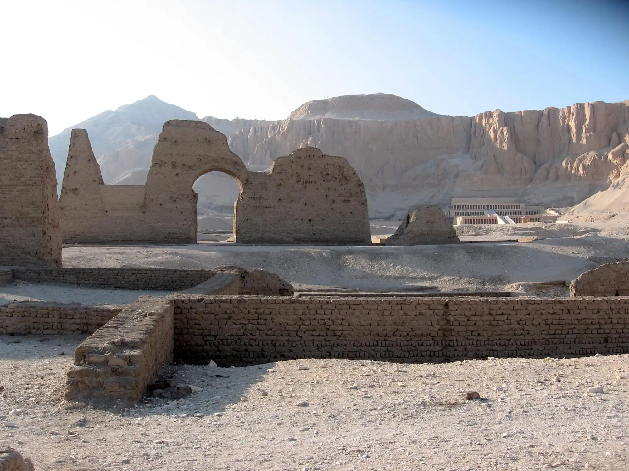 Modern restoration work at ancient Egyptian temple ruins in Deir el-Bahari