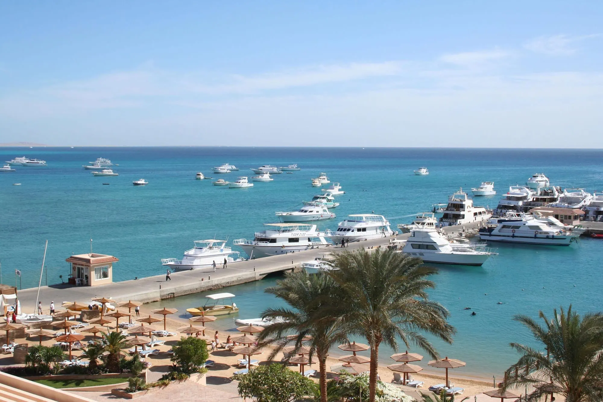 Marina with boats and yachts docked at Red Sea resort harbor