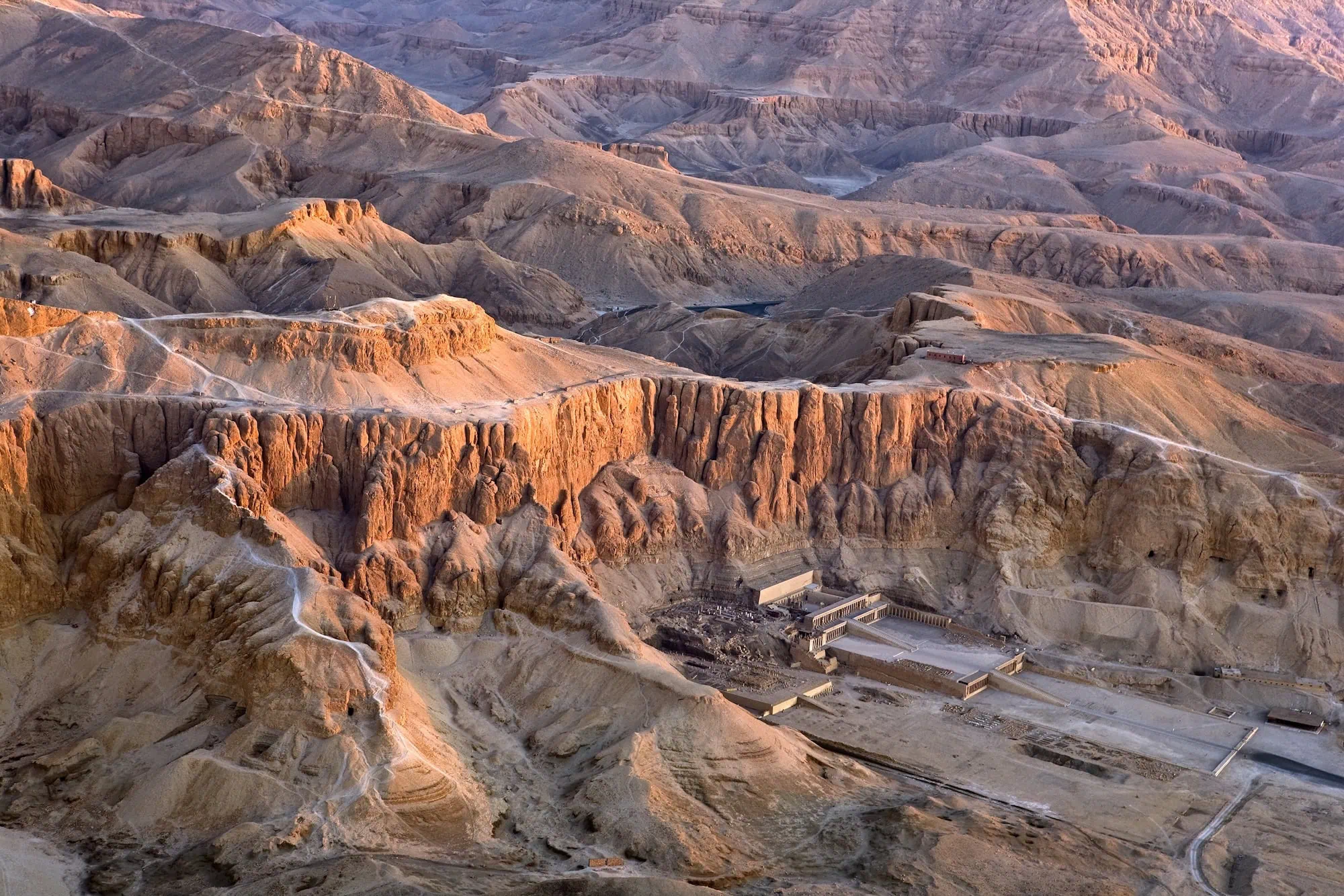Aerial view of Hatshepsut Temple terraces built into limestone cliffs in Valley of the Kings