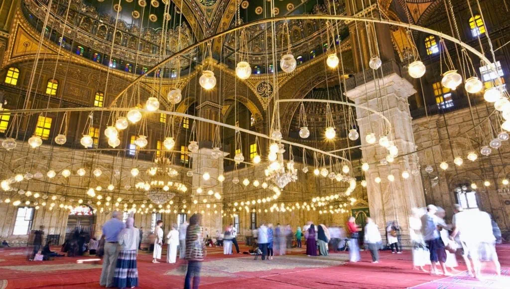Interior view of hanging lamps suspended from the domed roof inside the Mosque of Muhammad Ali, Cairo