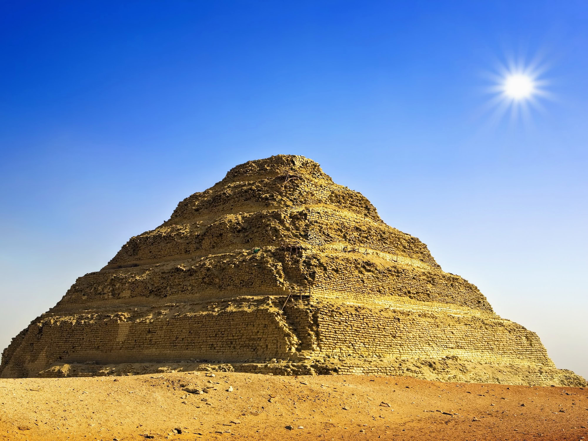 The ancient Step Pyramid of Djoser at Saqqara rising majestically from the desert sand