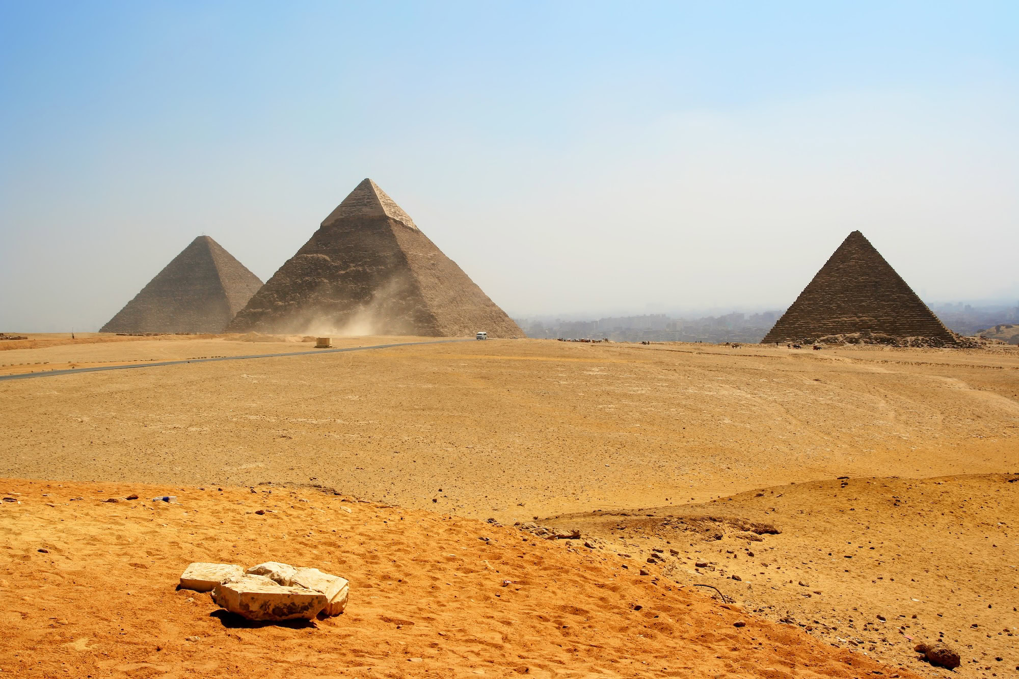 Pyramids of Giza with dust and hazy conditions in desert landscape