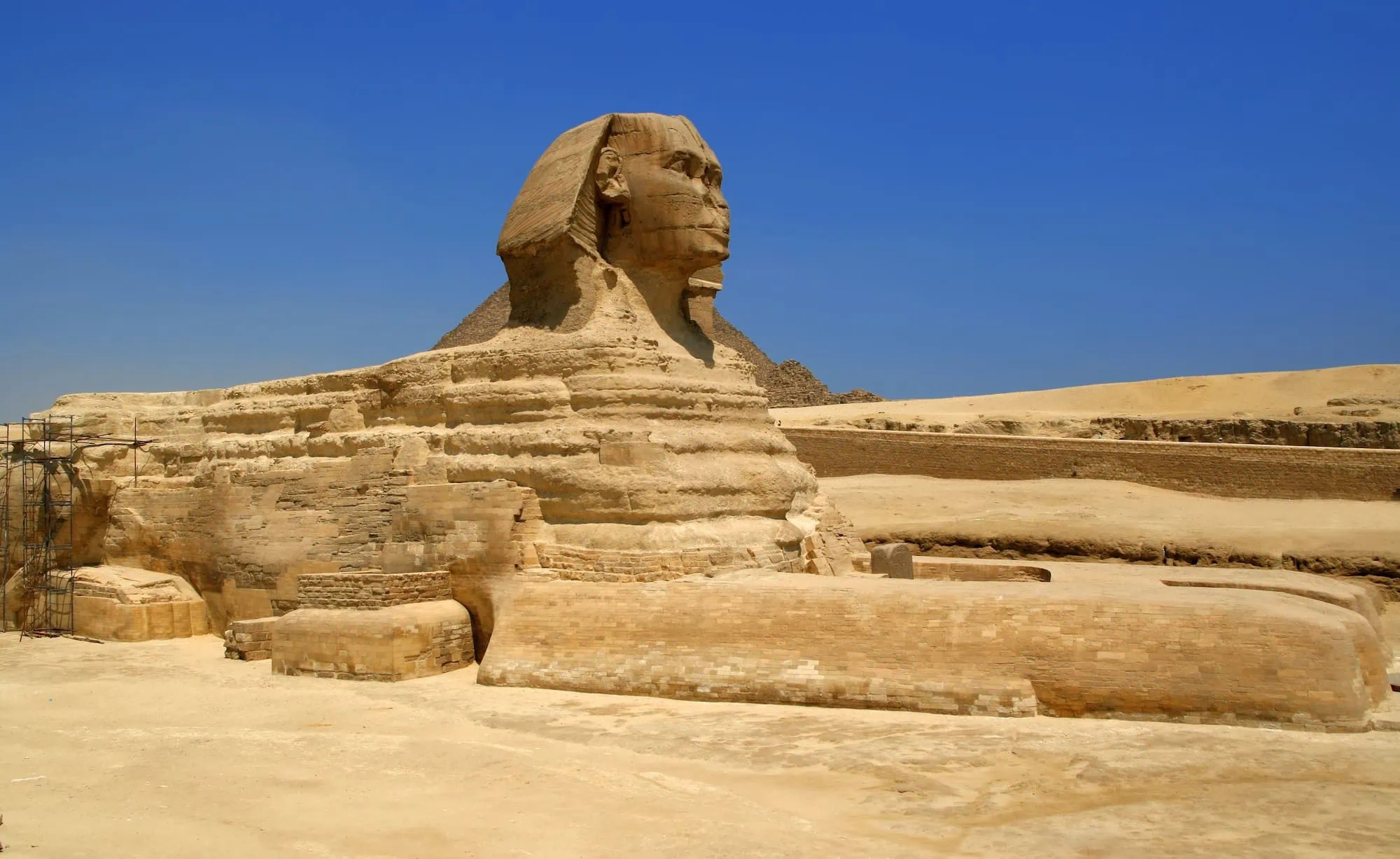 Great Sphinx of Giza with scaffolding showing ongoing archaeological work and excavation