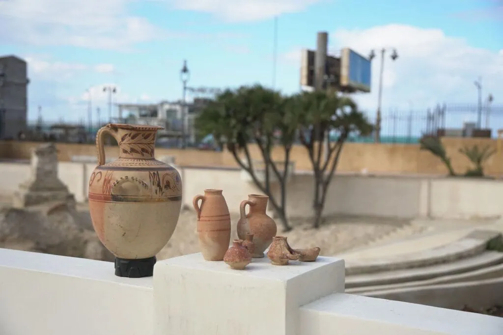 Ancient vases and ceramic jars displayed inside the El Shatby Tombs archaeological site, Alexandria