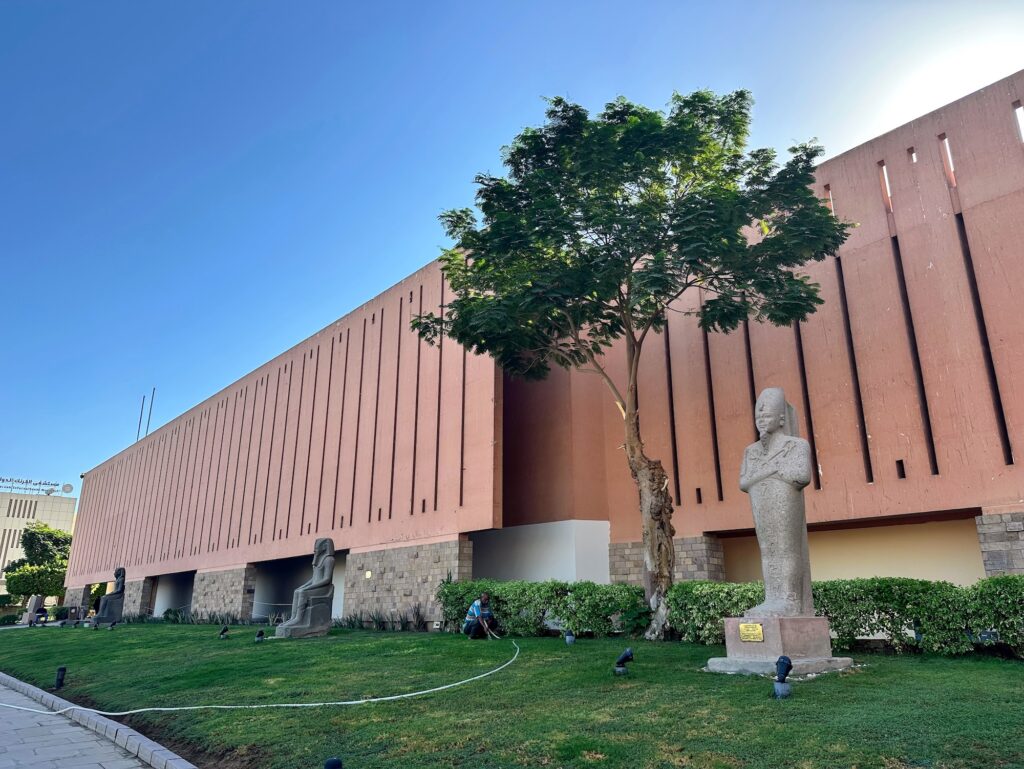 Exterior view of the Luxor Museum building under clear skies and bright sunlight, Luxor