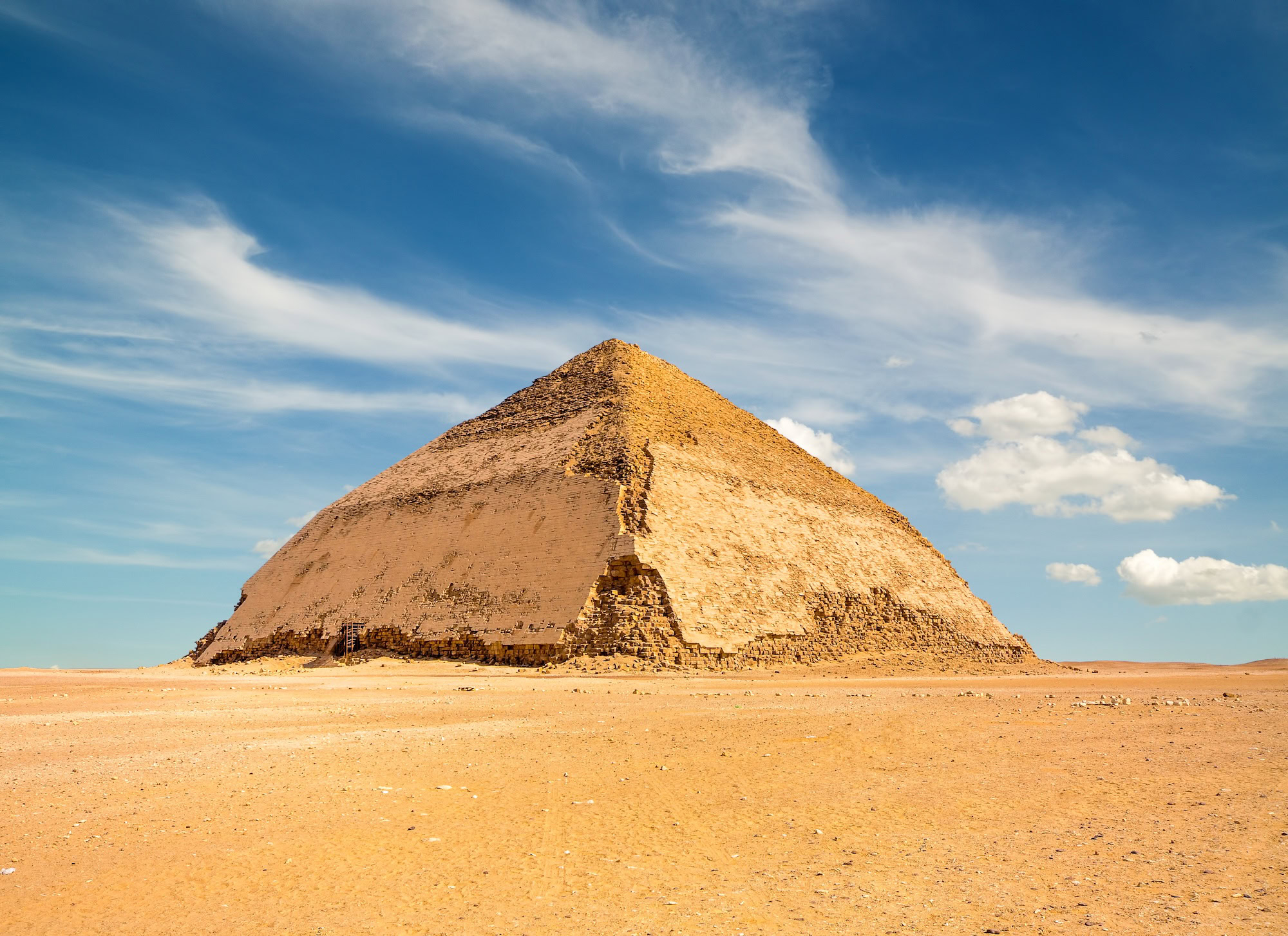Famous Bent Pyramid under puffy clouds Dahshur Egypt