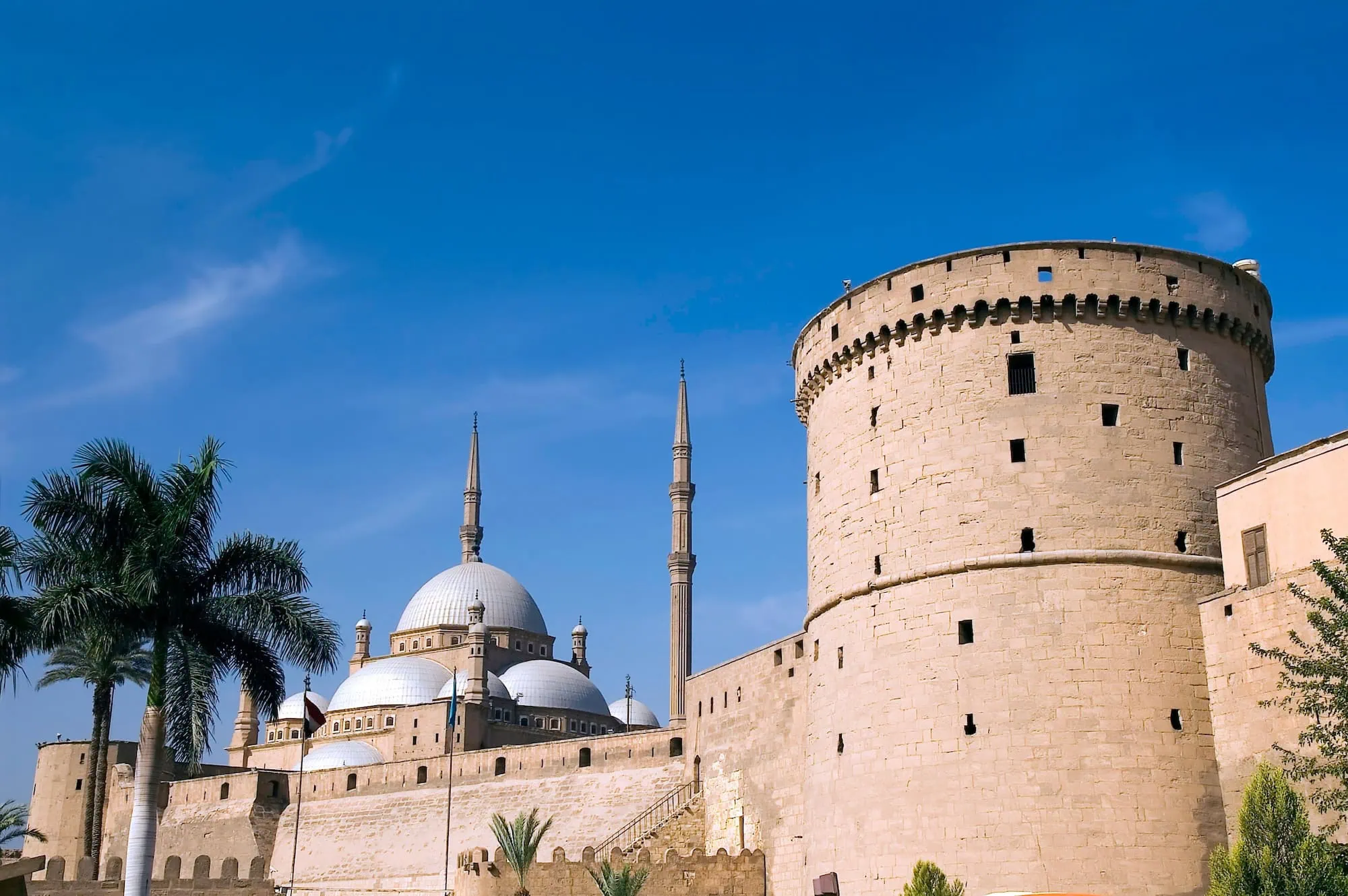 Mohamed Ali Mosque with white domes and minarets within Saladin Citadel's stone walls