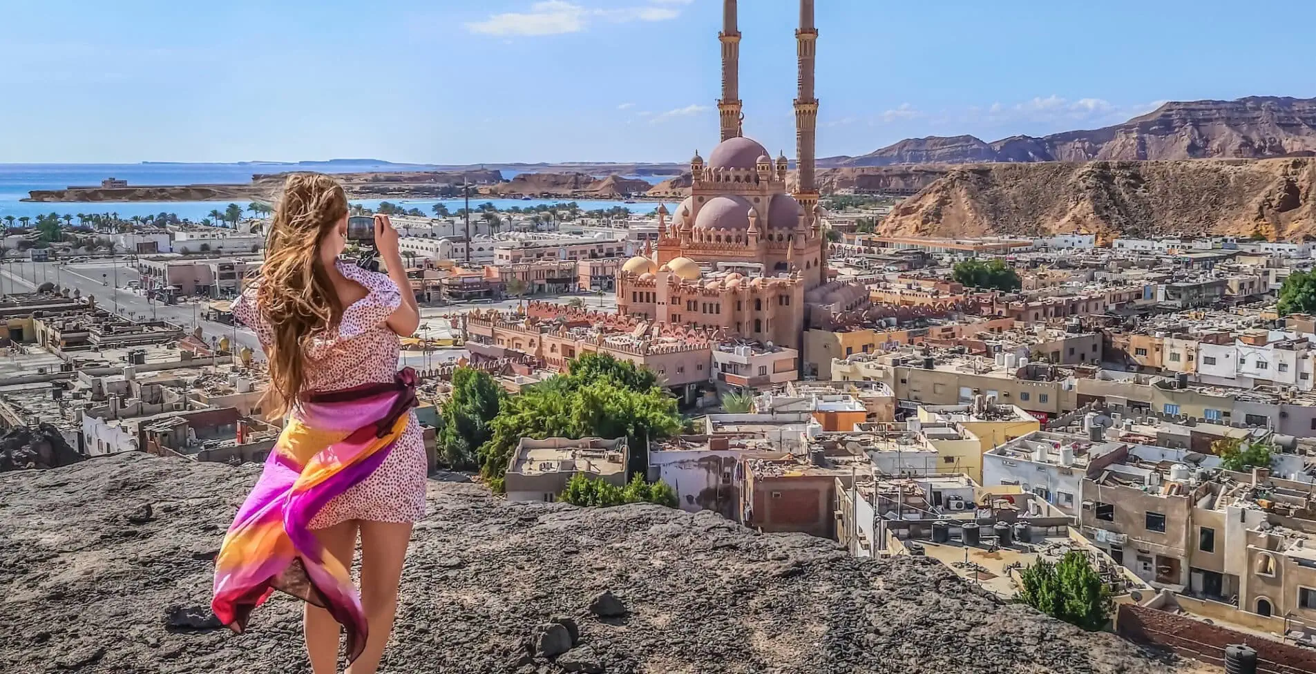 Female tourist shooting Al Sahaba Mosque in Sharm El Sheikh 1905x976 crop 50 46