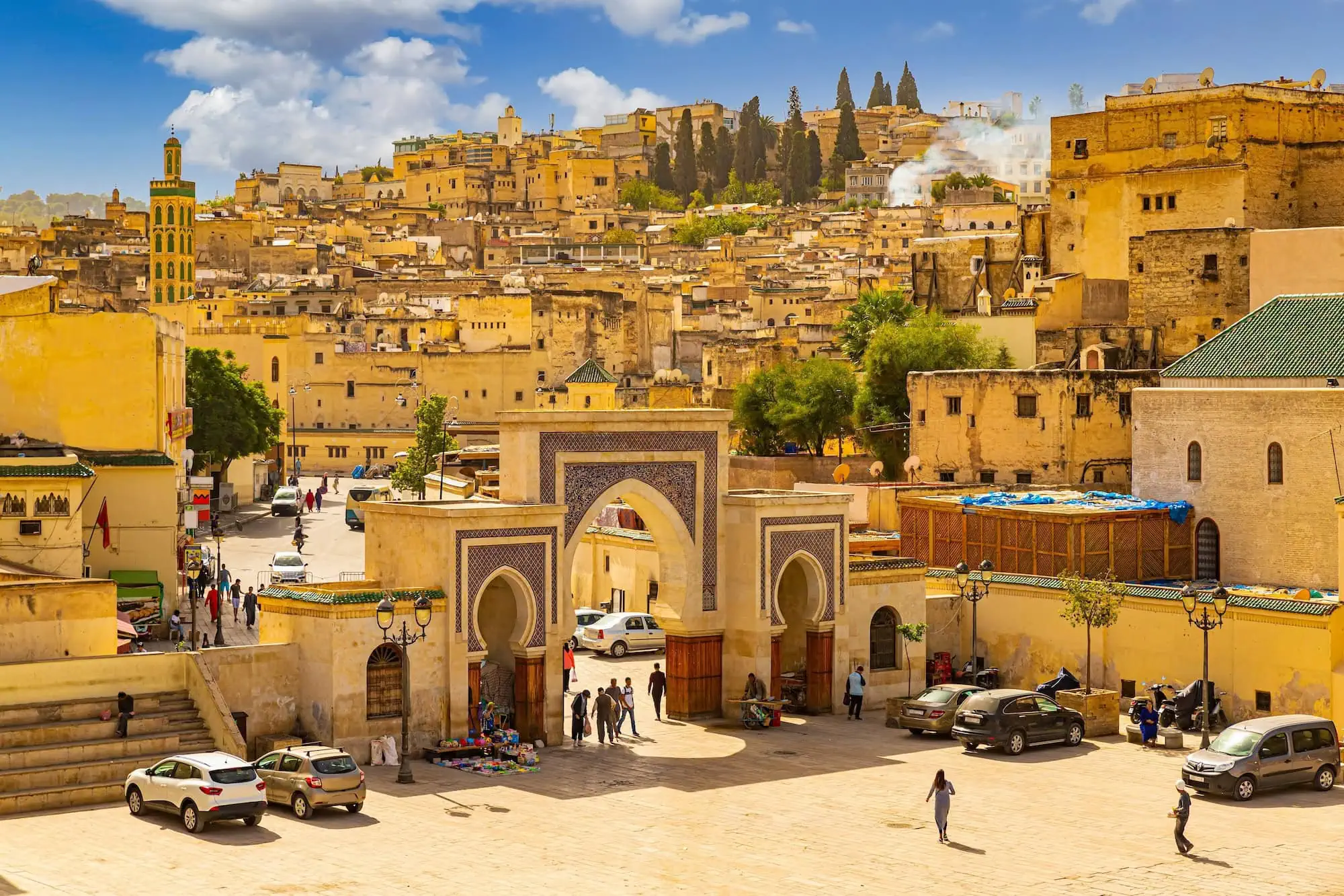 Panoramic view of Fes medina showing traditional yellow buildings and Islamic architecture