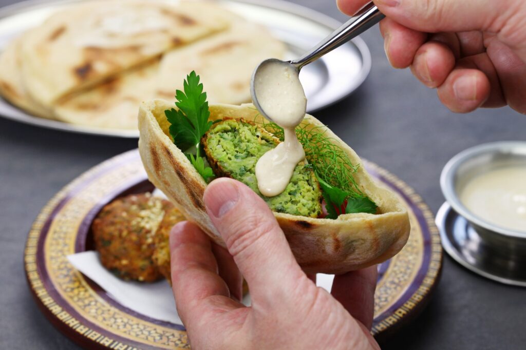 Egyptian falafel served in pita bread with tahini sauce