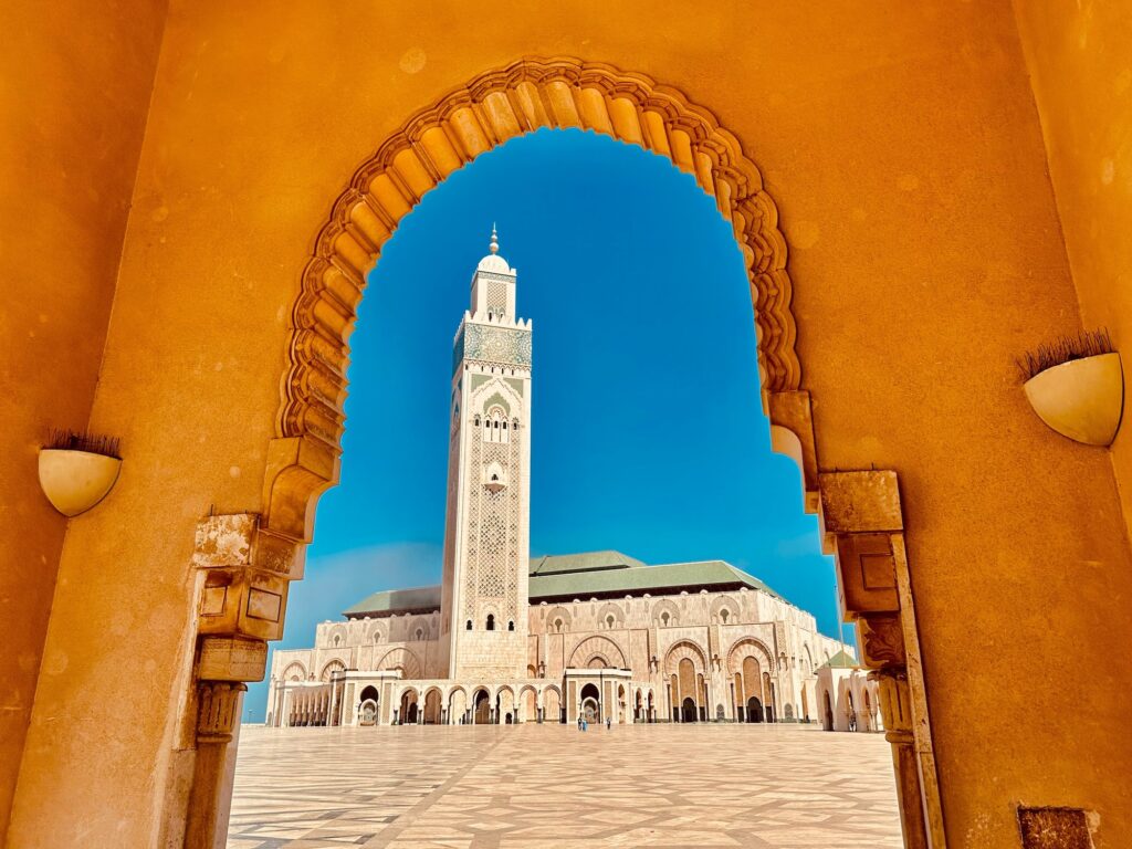 Framed view of Hassan II Mosque with minaret rising above the waterfront, Casablanca