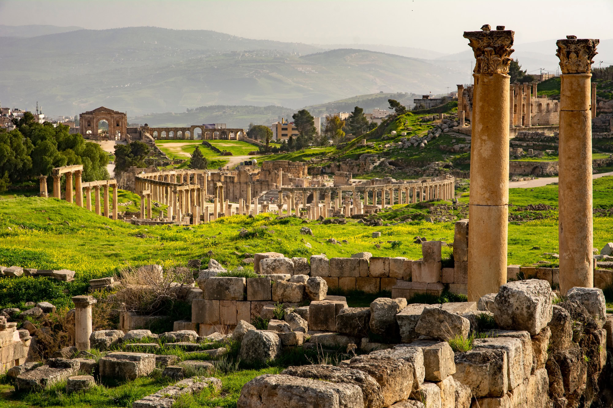 Ancient Roman columns and archway ruins at Jerash archaeological site