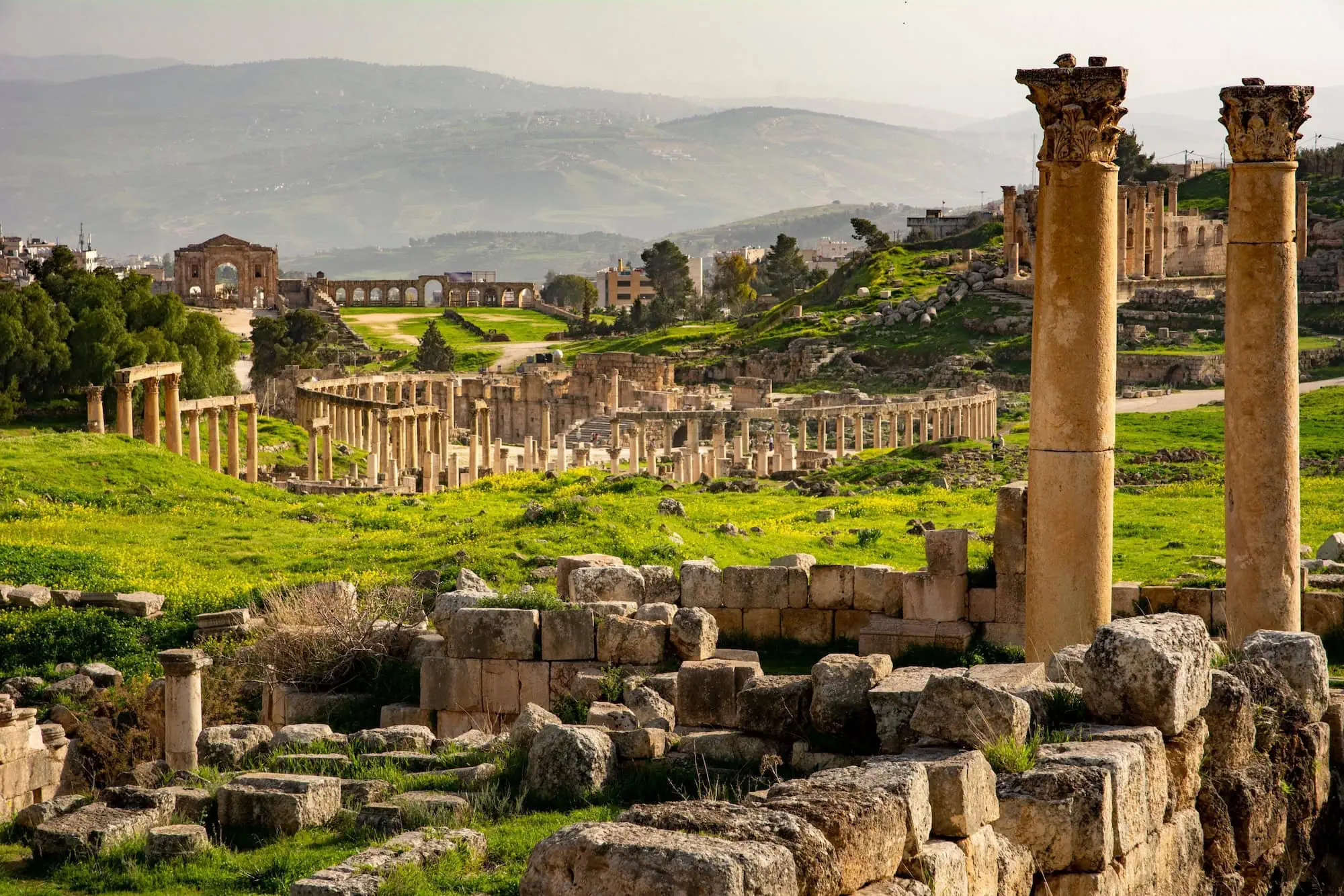 Ancient Roman columns and archway ruins at Jerash archaeological site
