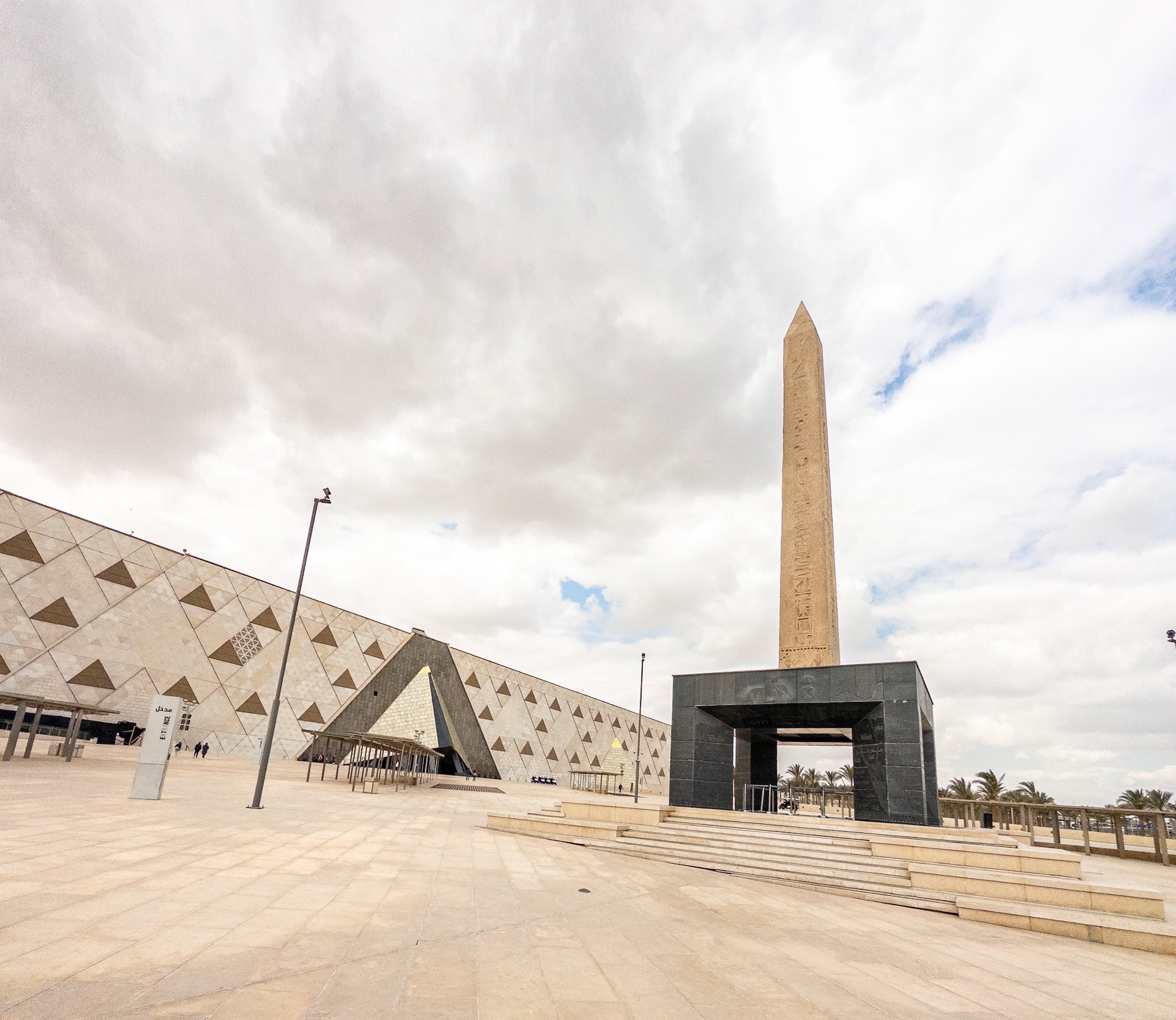 Grand Egyptian Museum with triangular facade and obelisk in Cairo, Egypt