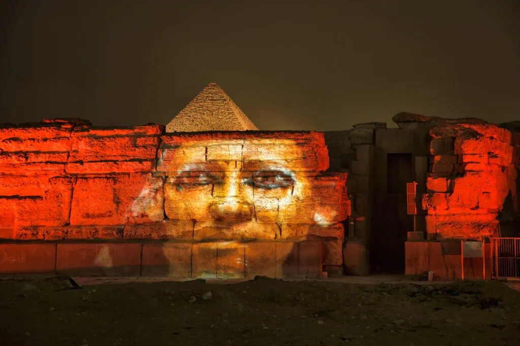 Giza pyramids and Sphinx illuminated during a sound and light show at night