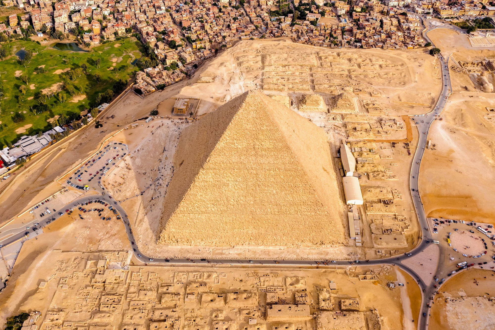 Aerial view of the Great Pyramid and Sphinx of Giza with surrounding archaeological site