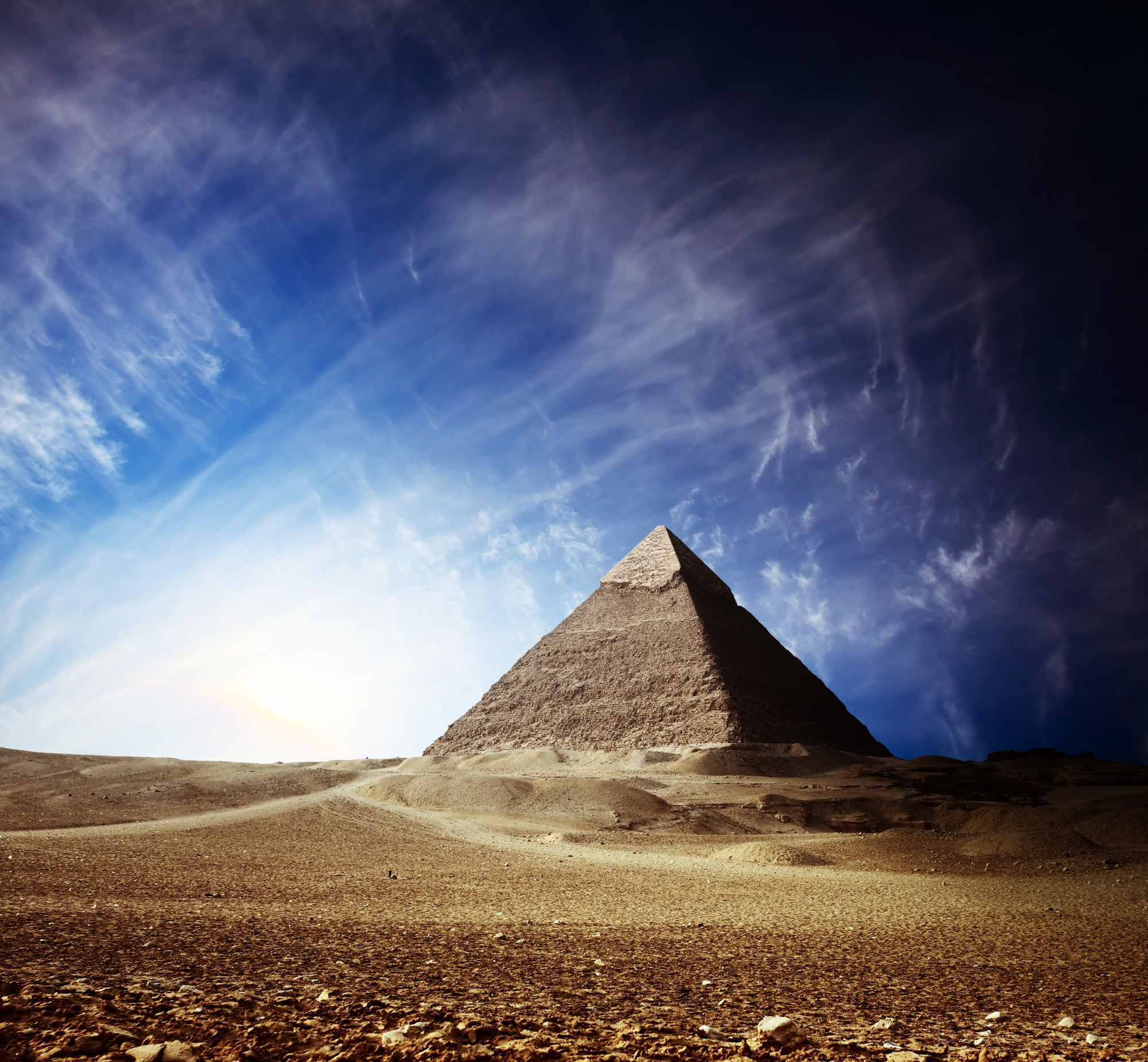 Great Pyramid of Giza standing majestically alone in desert landscape