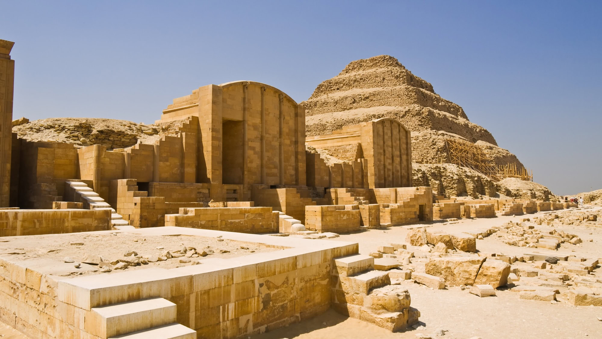 Step Pyramid of Djoser complex at Saqqara showing ancient stone columns and limestone ruins