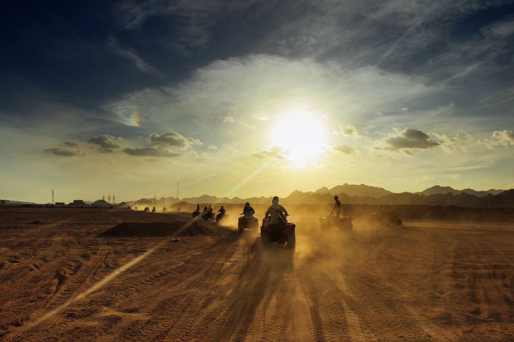Group of tourist on ATVs on Egyptian desert. Colored reworked