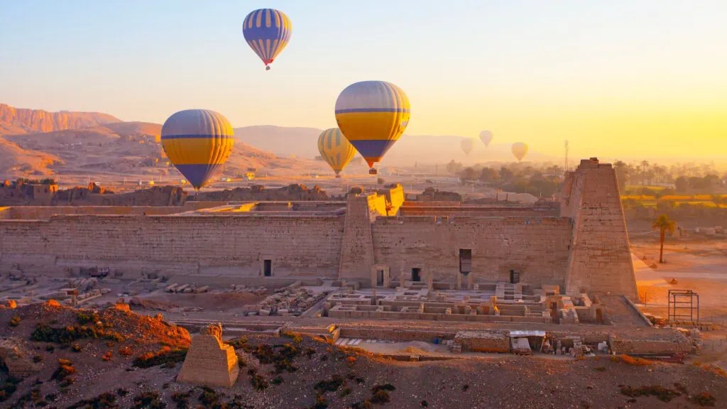 Hot air balloons floating above Luxor’s temples and ancient ruins