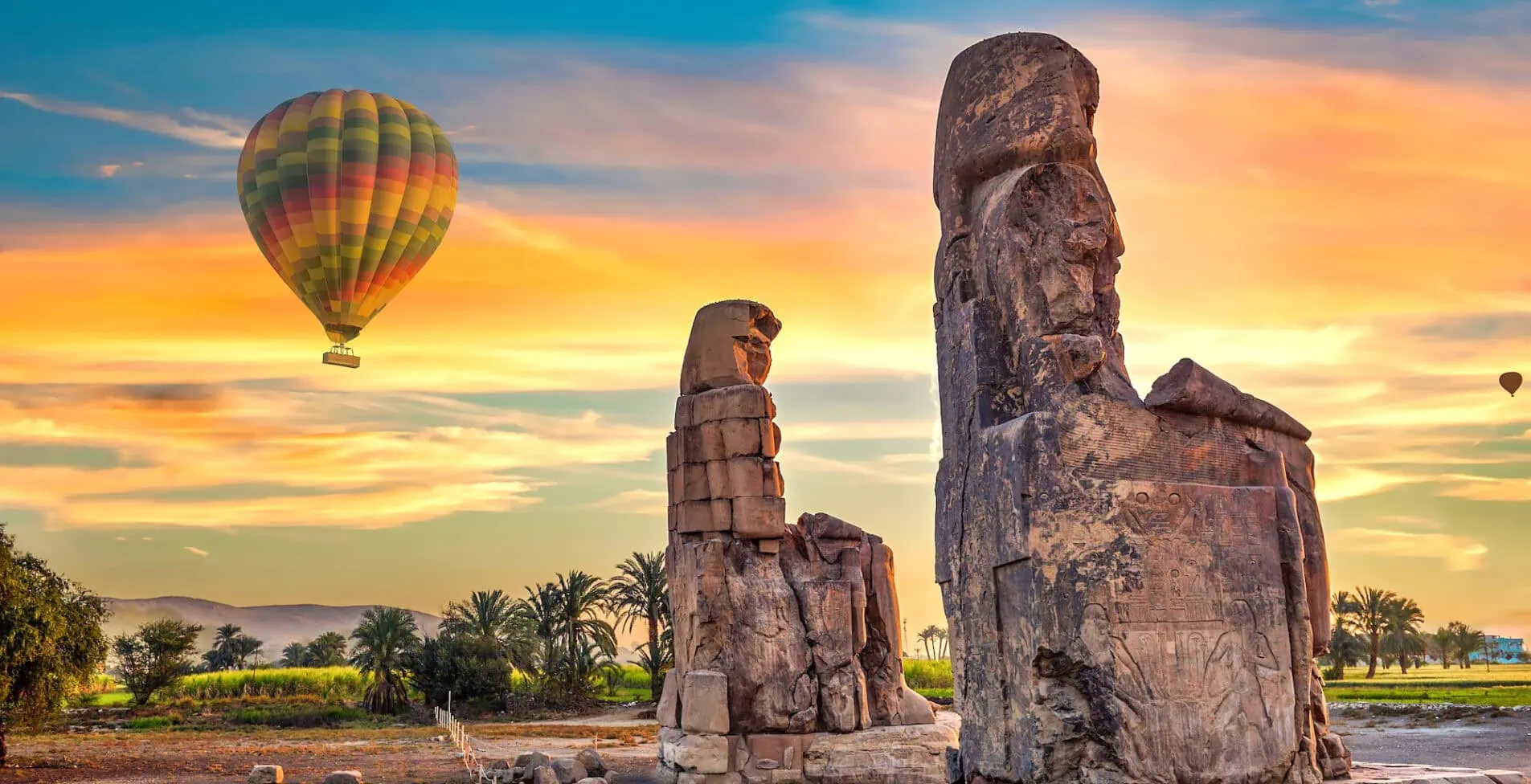 Hot air balloons and Colossi of Memnon in Luxor at sunrise 1905x976 crop 45 39