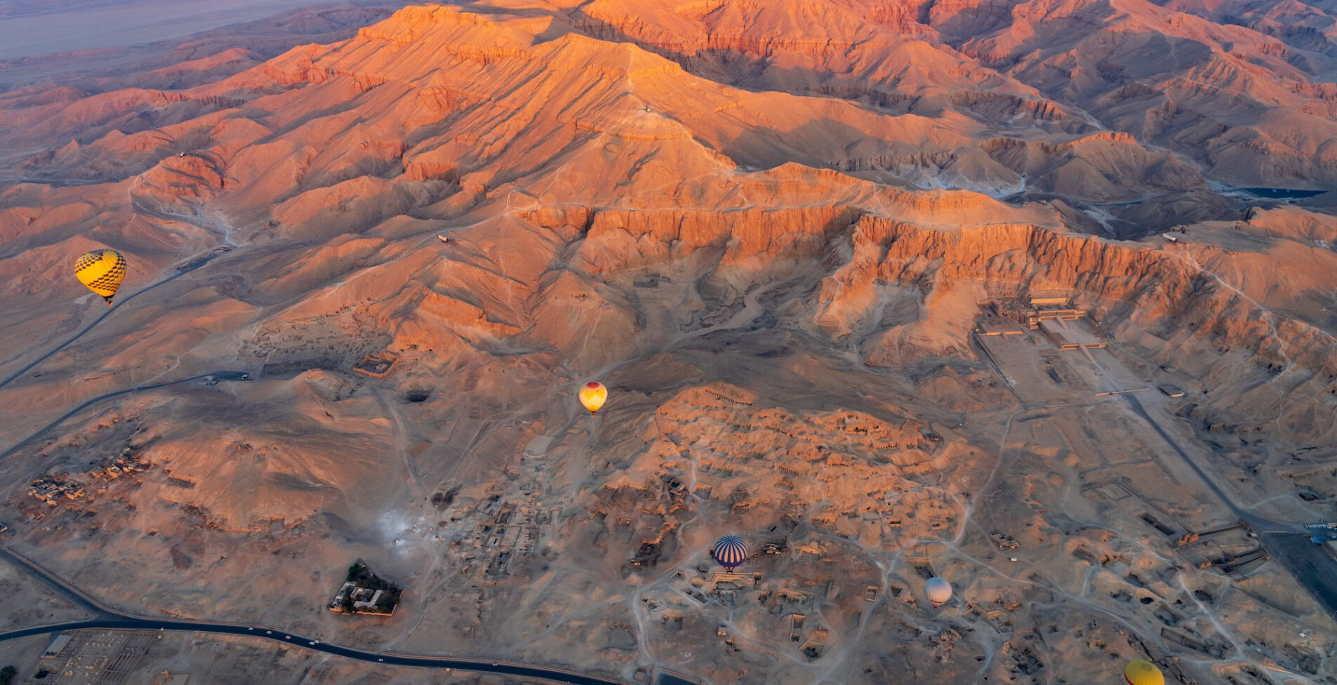 Hot air balloons over Temple of Hatshepsut at Deir el Bahari and Valley of Kings near Luxor Egpyt 1905x976 crop 50 74