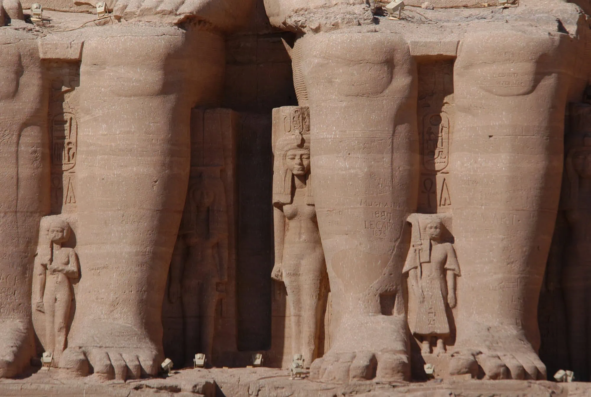 Ancient Abu Simbel temple with massive carved statues of Pharaoh Ramses II in Aswan, Egypt