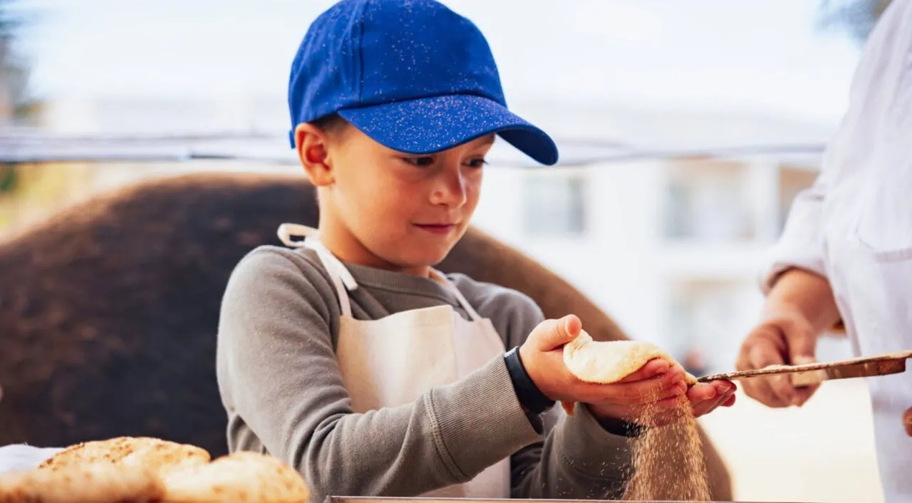 Hurghada in Egypt showing kid making Egyptian bread