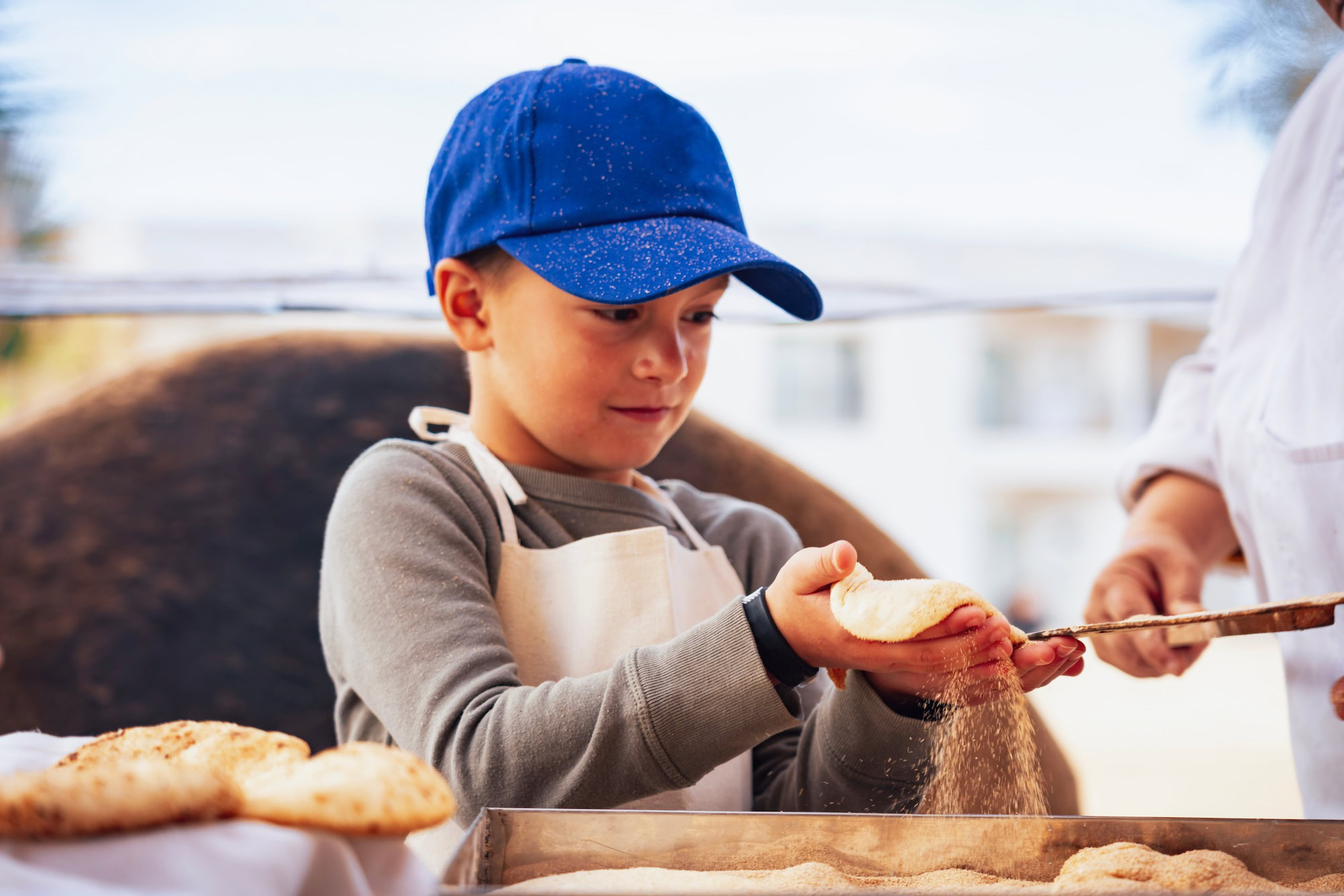 Hurghada in Egypt showing kid making Egyptian bread