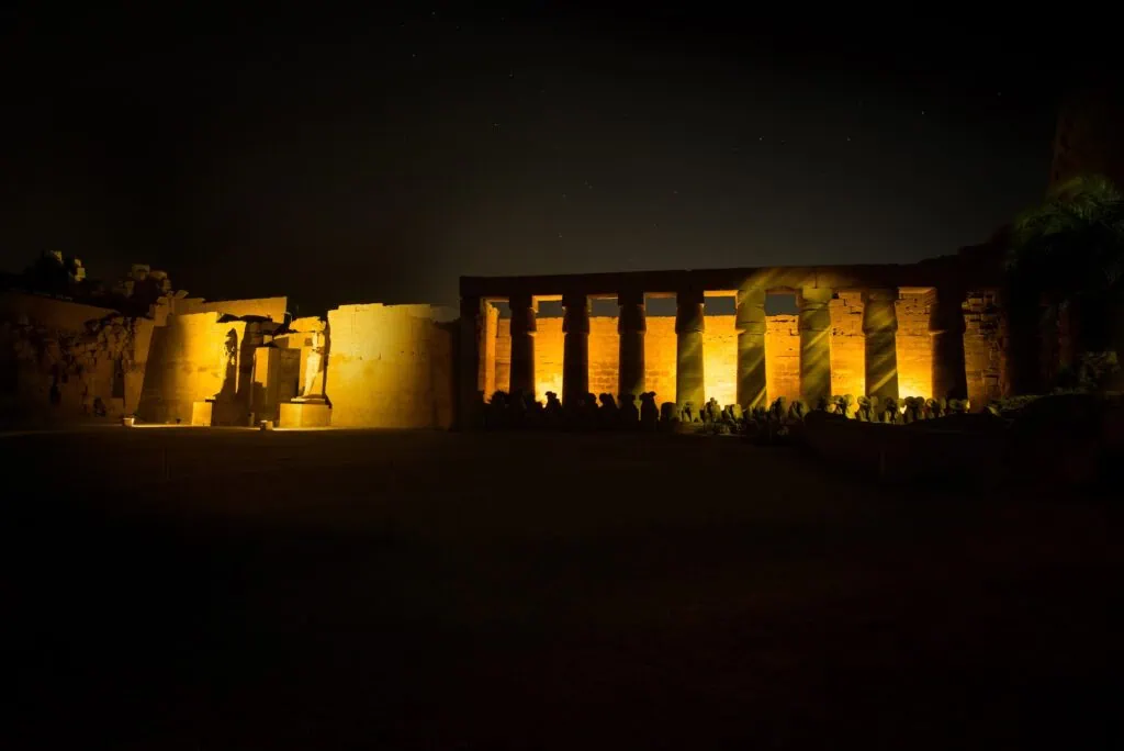 Illuminated columns and temple structures during the Sound and Light show at Karnak Temple, Luxor