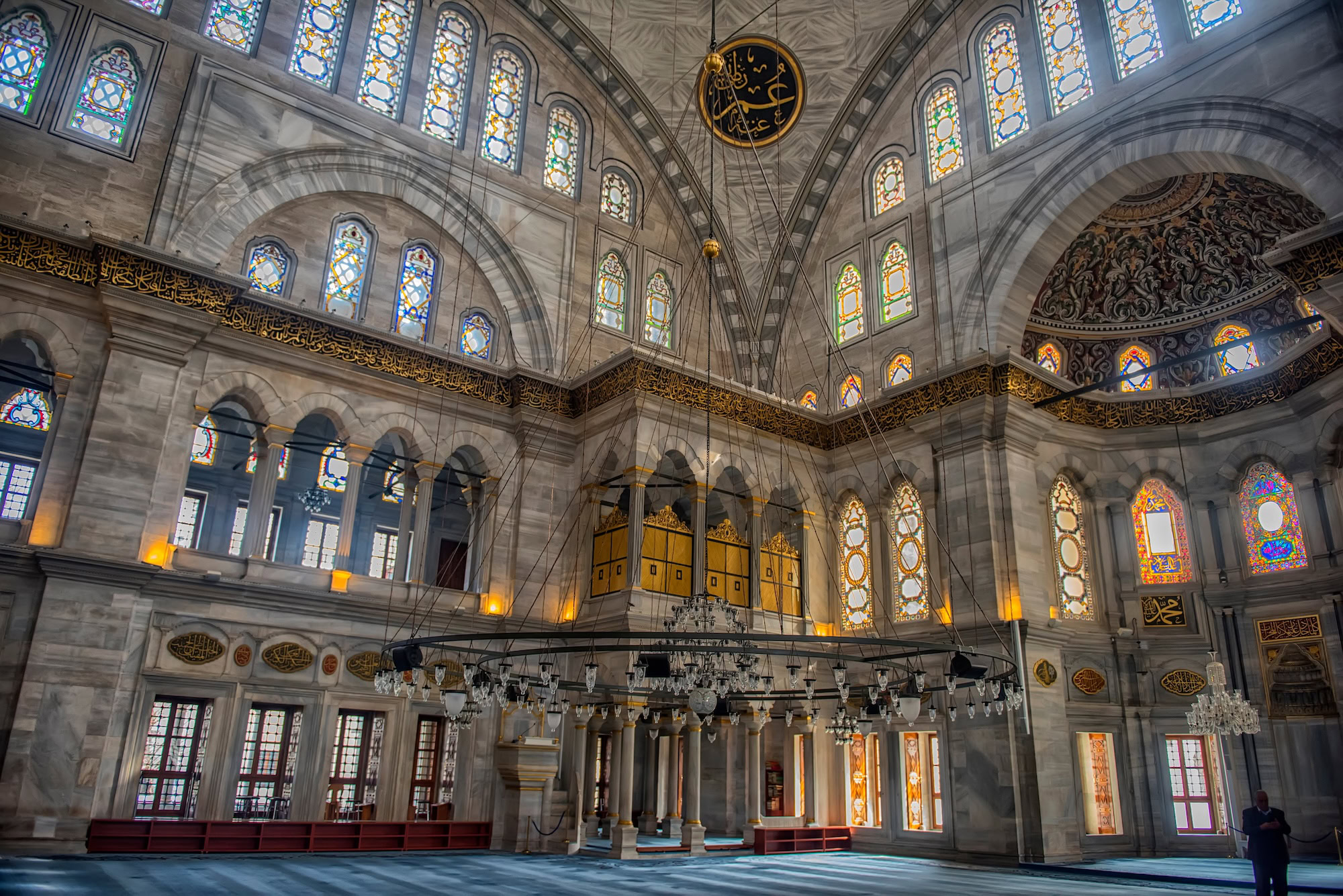 Interior of Istanbul mosque showing dome, arches, and Islamic architectural details
