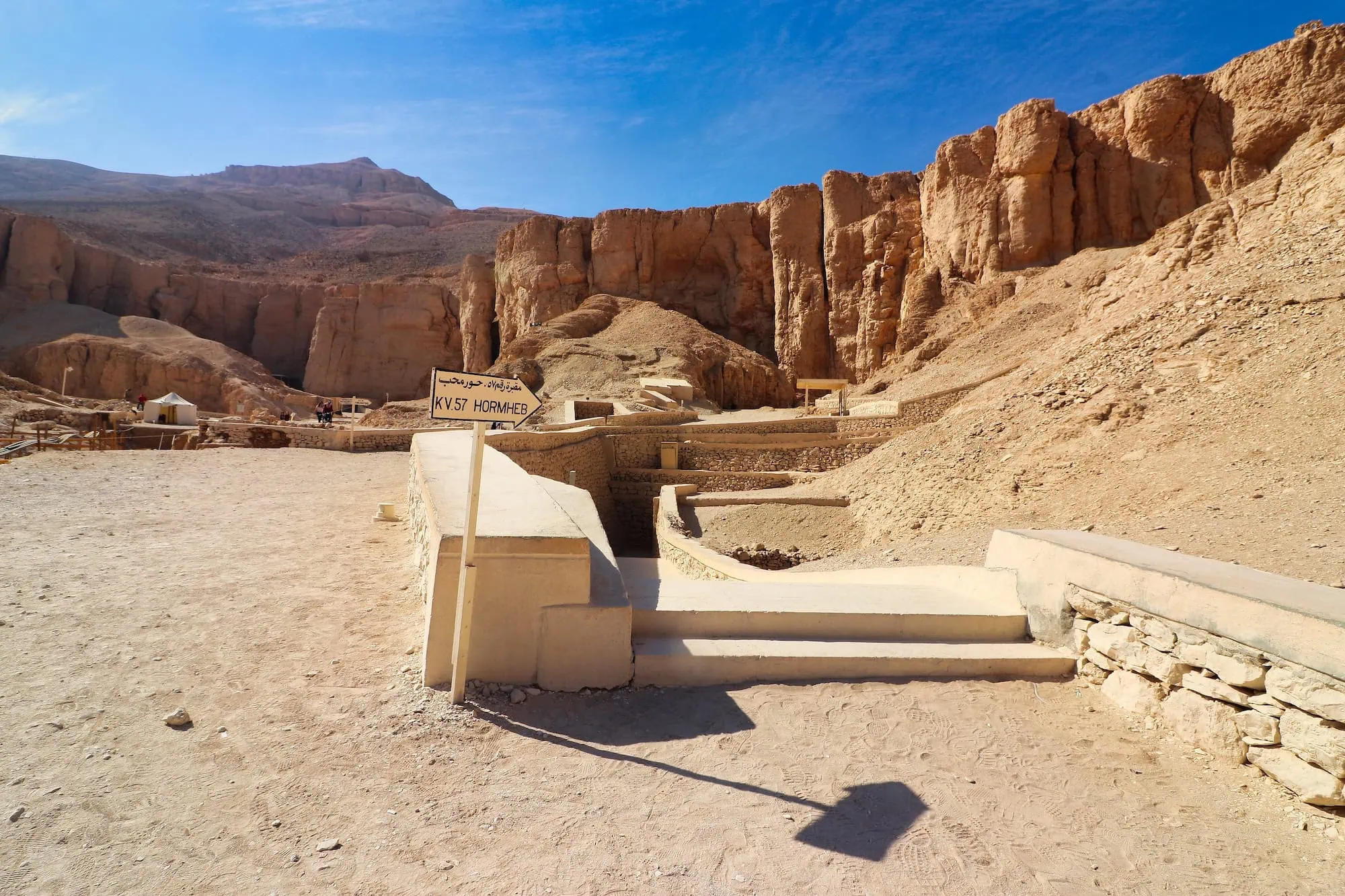 Entrance to Pharaoh Horemheb's tomb in Valley of the Kings with stone steps leading underground