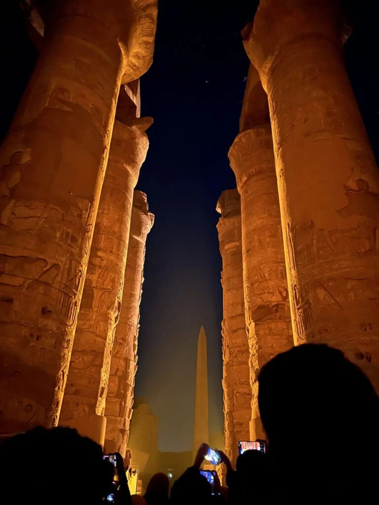 Illuminated stone pillars highlighted during the Sound and Light show at Karnak Temple, Luxor