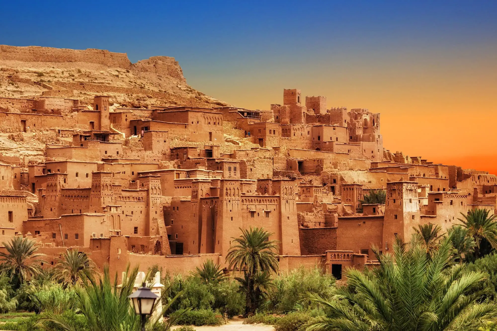 Sunset view of Kasbah Ait Ben Haddou, ancient fortified village with clay buildings
