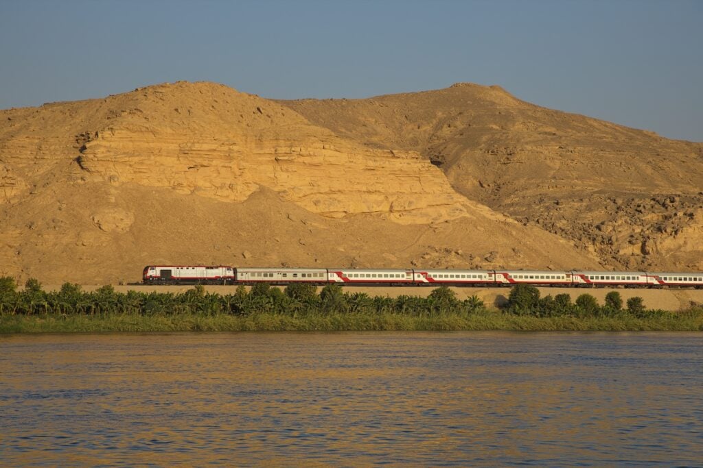 Train passing through desert landscape near As Siraj, As Siraj