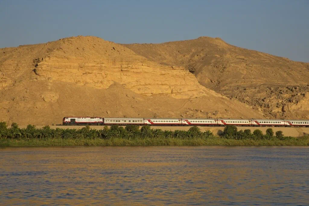 Train passing through desert landscape near As Siraj, As Siraj