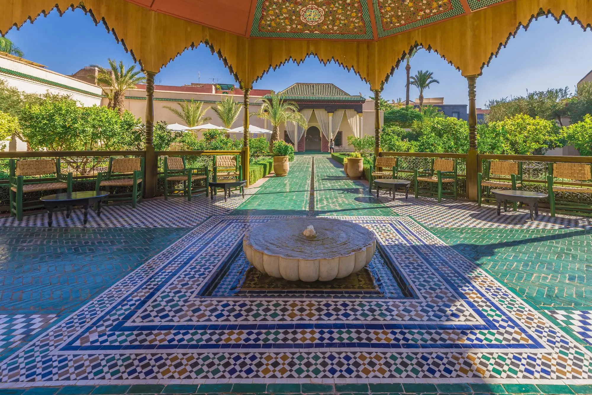 Traditional Moroccan garden with ornate fountain and Islamic architecture at Le Jardin Secret, Marrakech