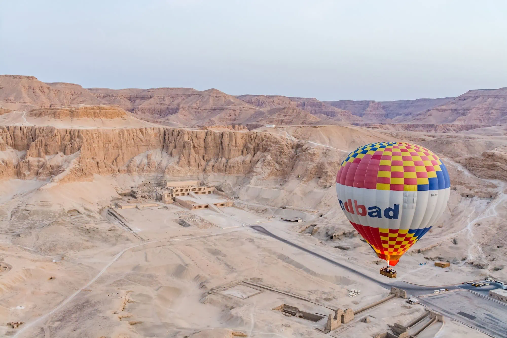 Hot air balloon floating above Hatshepsut Temple