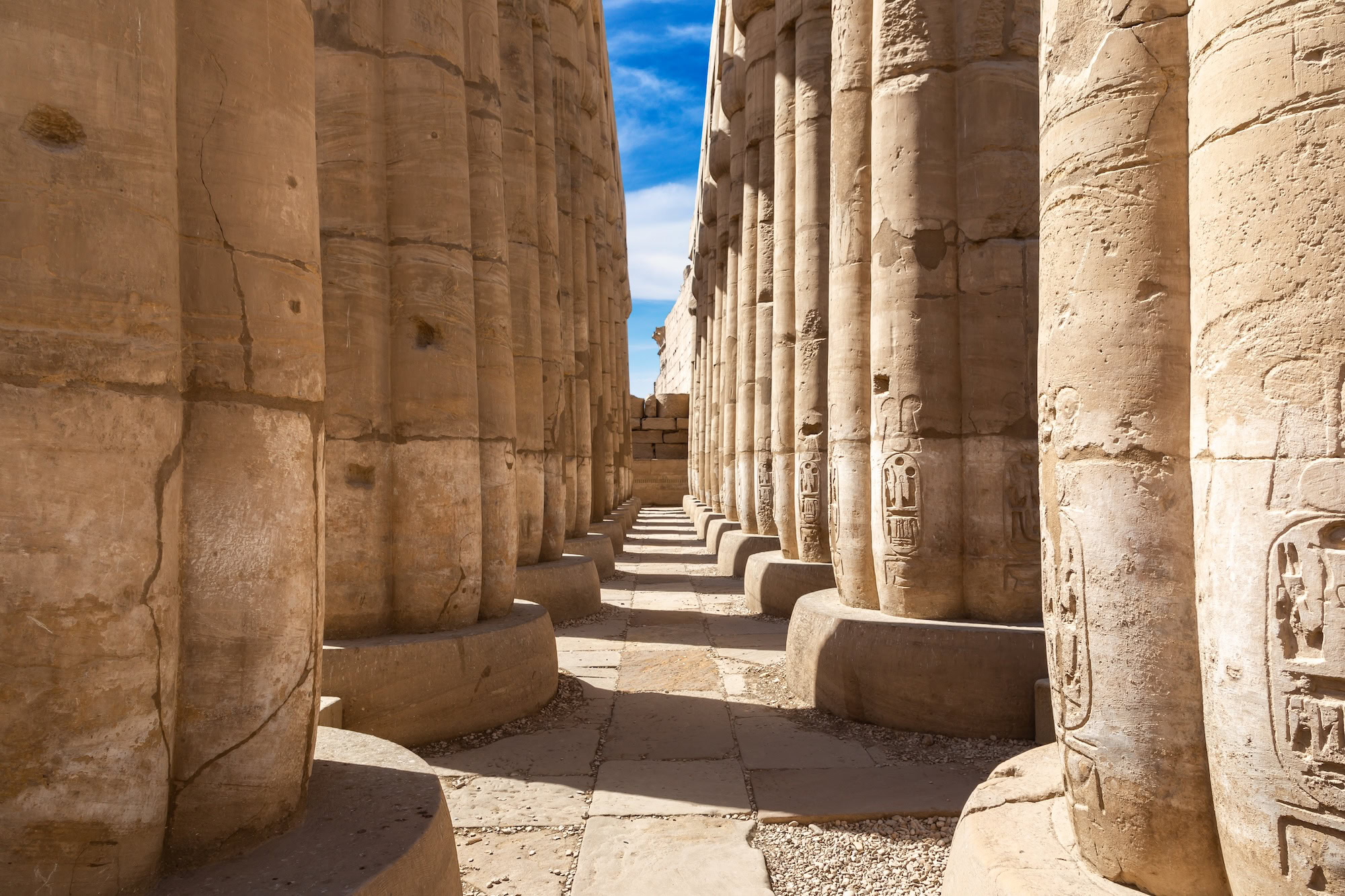Ancient temple columns with hieroglyphs at Karnak Temple Complex