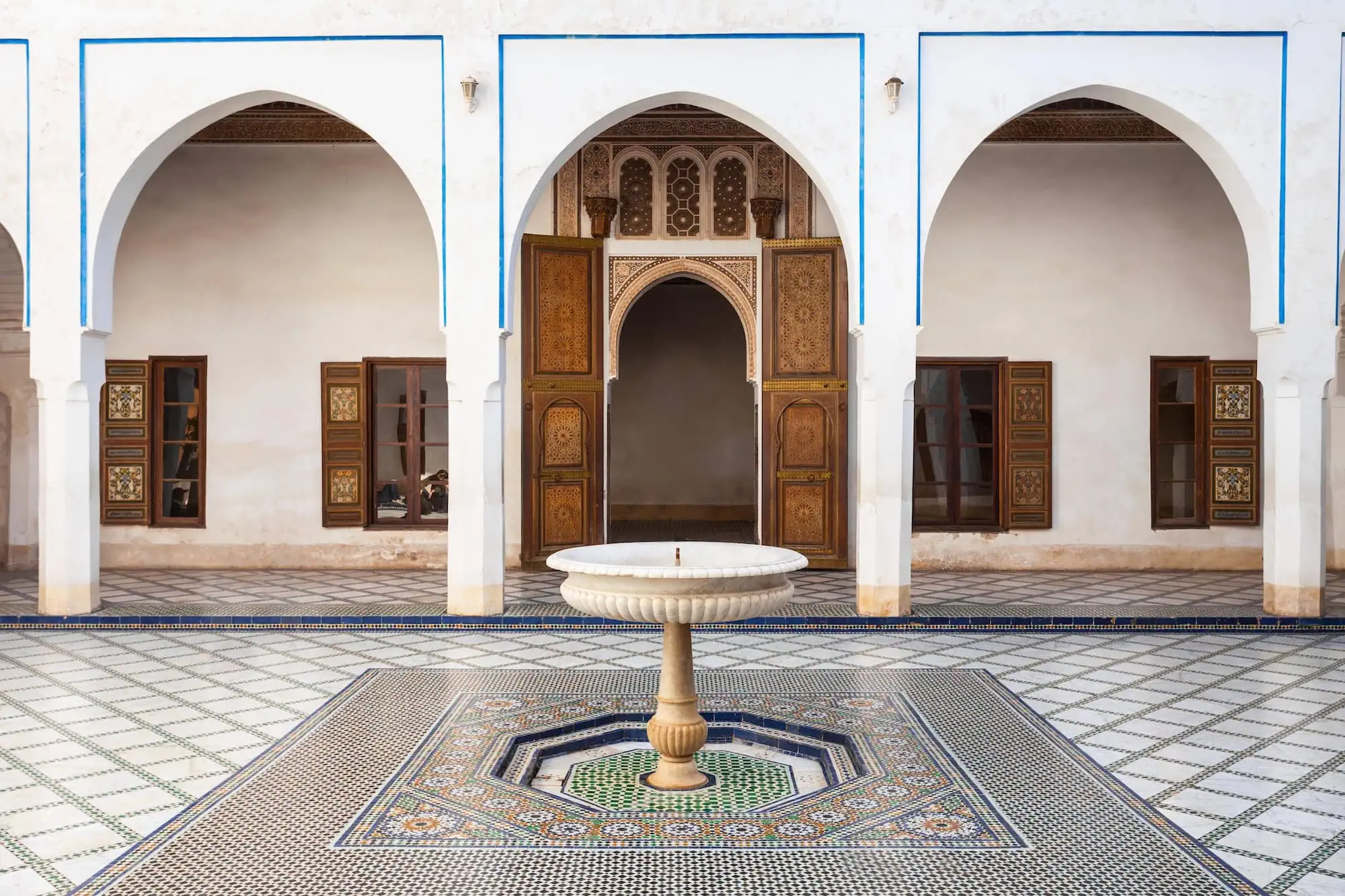 Ornate courtyard at Bahia Palace with Islamic arches, geometric tilework and central fountain