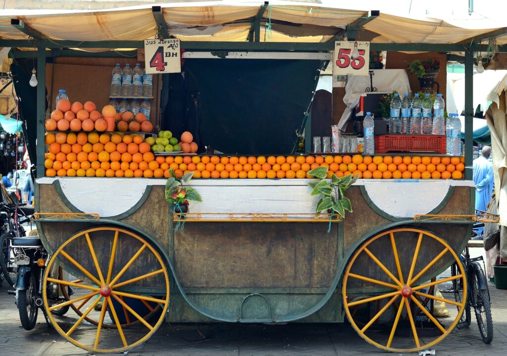MARRAKECH MOROCCO JUNE 4 Orange juice stand in jemaa el fna square on June 4 2012 in Marrakech Morocco. Marrakech is the second largest city and the most popular tourist destination